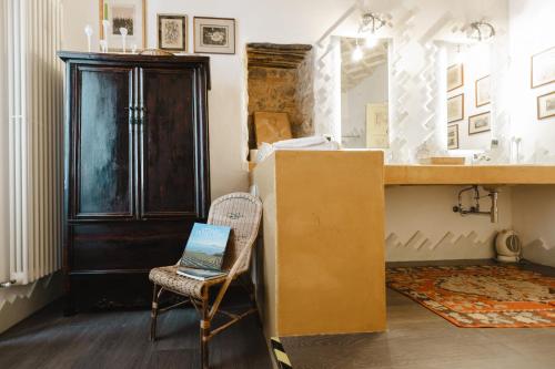 a room with a desk and a chair with a laptop on it at Tenuta Rasocolmo in Messina