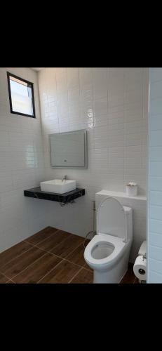a bathroom with a white toilet and a sink at Love koh tao villa 2 in Ko Tao