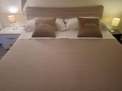 Giường trong phòng chung tại LA CASA DI NANA'