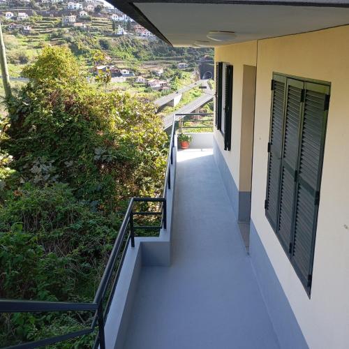 a balcony of a house with a view at Yellow Owl II - Bedroom III in Campanário