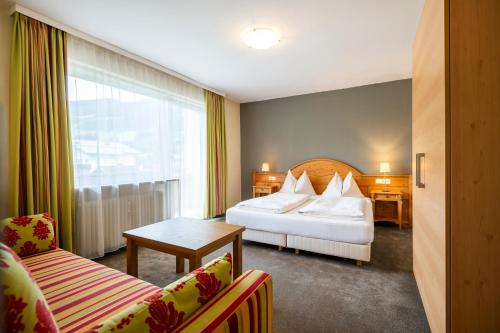 En eller flere senge i et værelse på Arkadia Apartments