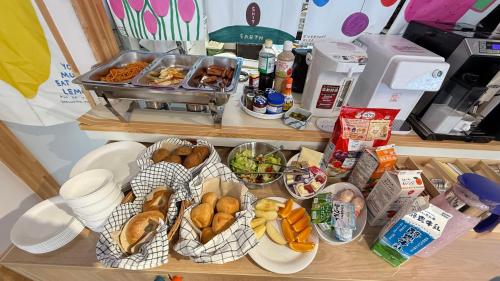 a counter with many baskets of food on it at WildChild in Hakuba