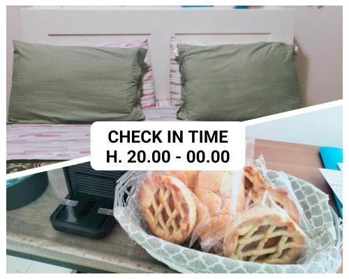 a basket of waffles on a table next to a bed at La Perla B & B in Ciampino