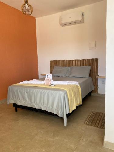 a bedroom with a bed in a room at Pousada Dunnas do Thyago - preços de inauguração - Praia de Caraúbas - Vista para o mar e para as dunas in Maxaranguape