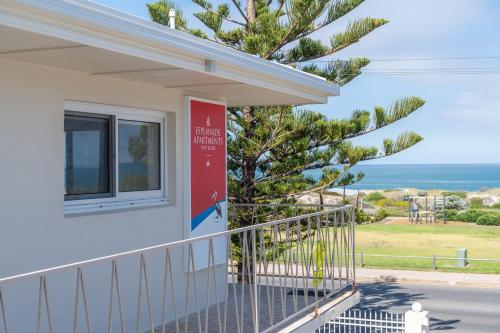 a house with a balcony with a view of the ocean at Esplanade Apartments at West Beach in Adelaide