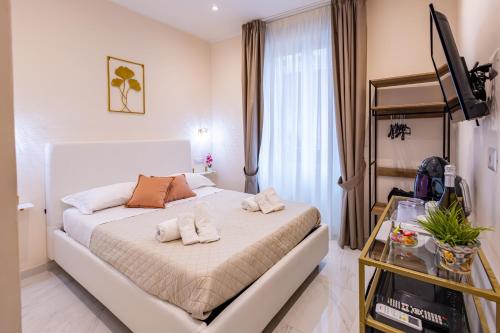 Giường trong phòng chung tại Ginevra Luxury Taormina