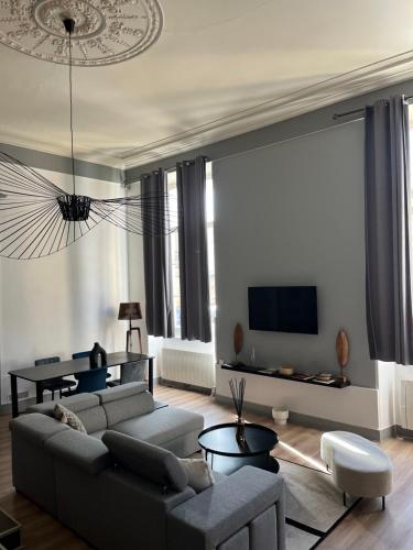 Et opholdsområde på Appartement au Palais - WIFI