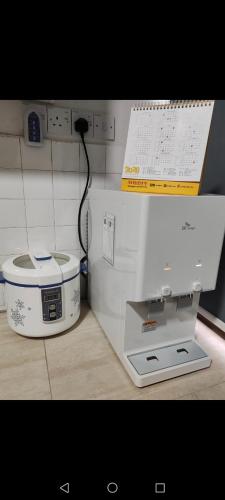 a white machine sitting on top of a counter at Tambun - Near LWOT, PLUS Highway Access ,Sunway & Pantai Hosp in Tambun