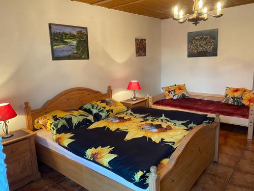 a bedroom with two beds and two lamps at Chalupa Obora in Cerhonice