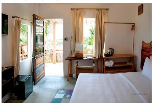 Postel nebo postele na pokoji v ubytování Stop And Go Lang Chai Boutique Resort