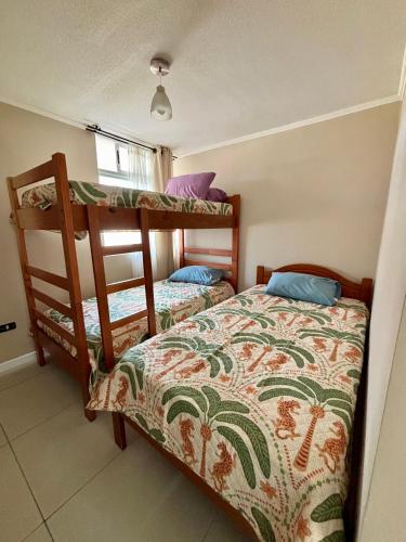 Postel nebo postele na pokoji v ubytování Departamento Costanera del Mar