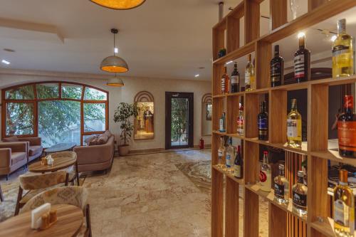 a room with shelves filled with bottles of alcohol at Dastan Boutique Hotel Baku in Baku