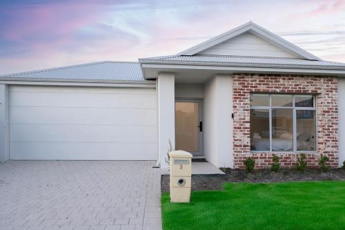 a house with a white garage at Henley Brook - Finest in Henley Brook