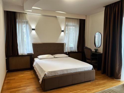 En eller flere senge i et værelse på Hillside Garden by Sienna