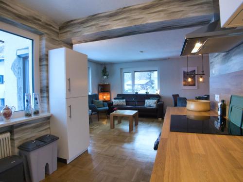 a living room with a couch and a table at Jagerheim Apartments Flattach in Flattach