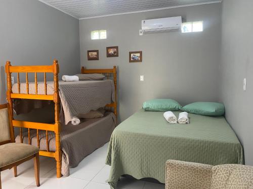 En eller flere senge i et værelse på Pousada Ferreira 415