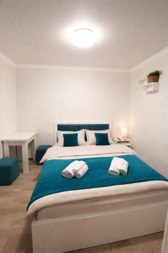 a bedroom with a large bed with two pillows at garden and panorama in Mtskheta