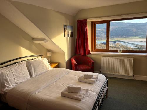 En eller flere senge i et værelse på Bryn Melyn Apartments