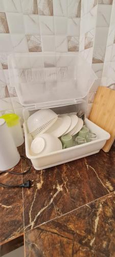 a white container sitting on top of a counter at Samati Best House - Pool Apartments A1 - Klong Ning Beach in Ko Lanta Yai