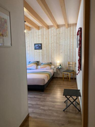 En eller flere senge i et værelse på Lo Saunei