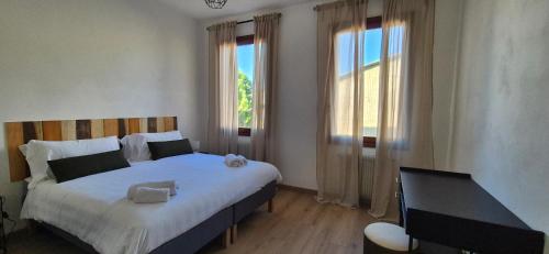 Dimora Astolfo 1-2-3 객실 침대