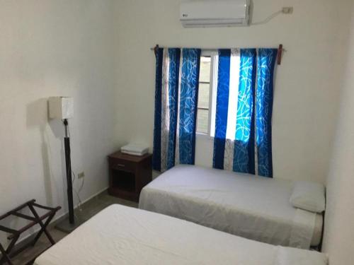 Een bed of bedden in een kamer bij Casa de Diamantes