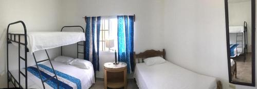 Een bed of bedden in een kamer bij Casa de Diamantes