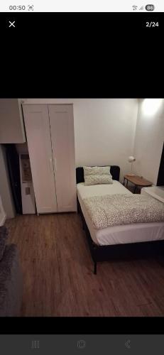 a bedroom with a bed and cabinets in it at Apart studio3 in Kortenberg