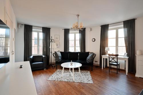 a living room with a couch and a table at Haffelberg House in Riga