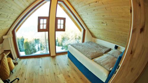 En eller flere senge i et værelse på Chalets Frauenalpe