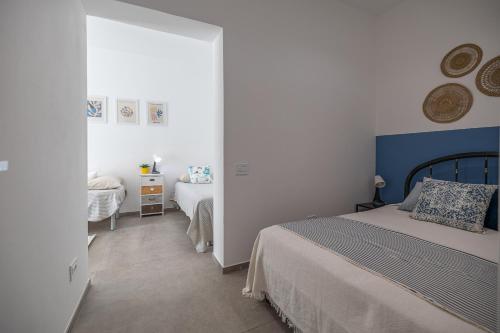 a bedroom with two beds and a window at Appartamento Garden in Riccione