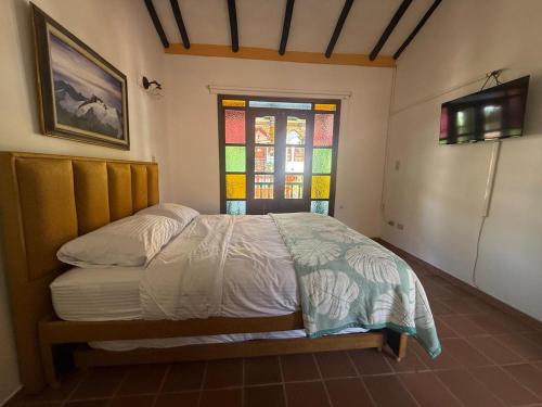 Un ou plusieurs lits dans un hébergement de l'établissement Monguí Posada Familiar