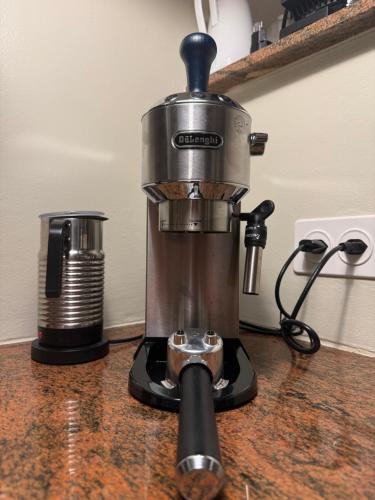 a coffee maker sitting on top of a counter at Casa d'epoca con giardino 5 min da Locarno in Minusio