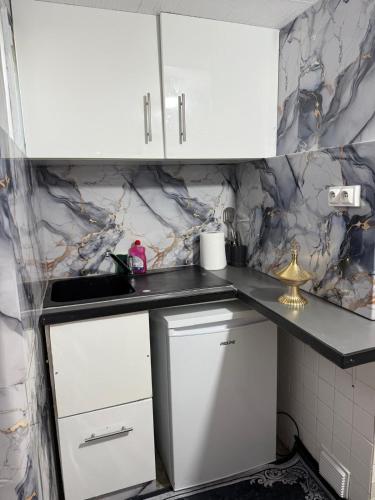 Kuchyň nebo kuchyňský kout v ubytování Charmante petite maison avec jardin