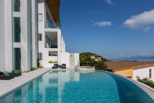 a swimming pool in the middle of a building at Penthouse Residence 8 Suite 2 in Nathon Bay