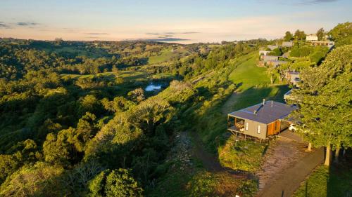 an aerial view of a house on a hill at The Ridge at Maleny Deluxe Residence - Panoramic Valley Views in Maleny