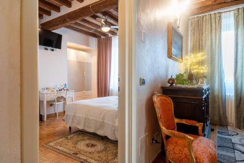 En eller flere senge i et værelse på La Fossetta B&B