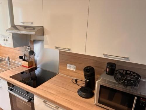 Kuchyň nebo kuchyňský kout v ubytování Côté Criée sur le port de pêche