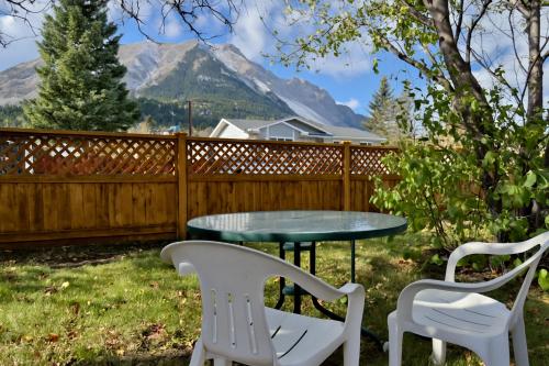 a patio with a table and chairs and mountains at Hillcrest Hideaway Spacious Mountain View Oasis in Hillcrest Mines