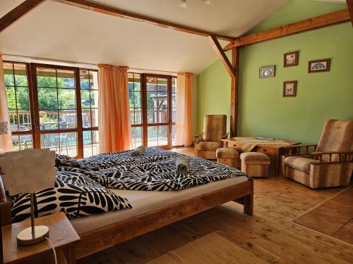 a bedroom with a zebra print bed in a room at Apartmány Krásné zátiší in Krásno