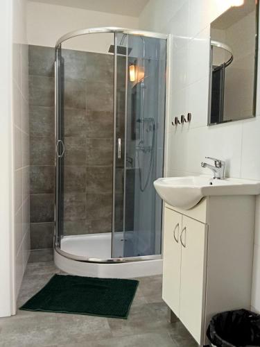 a bathroom with a shower and a sink at Willa Cieszynianka in Wisła