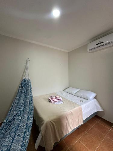 a bedroom with a bed with a net on it at Preá Beach Flat in Cruz