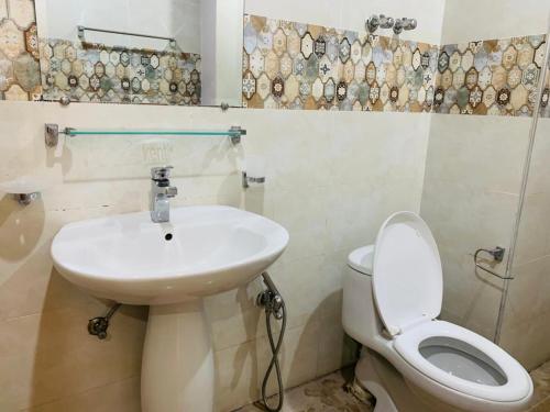a bathroom with a sink and a toilet at Pavilion 99 Serenity Appartment 2bhk in Rawalpindi