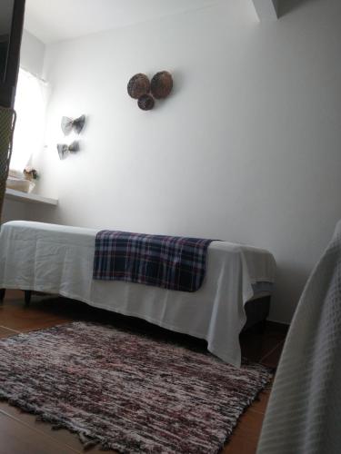 En eller flere senge i et værelse på Cantinho Da Josete Apartamento