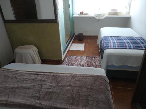 En eller flere senge i et værelse på Cantinho Da Josete Apartamento