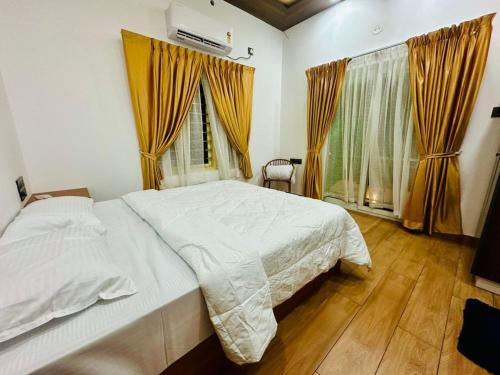 Postel nebo postele na pokoji v ubytování Ostia Marari - a Boutique Beach Stay