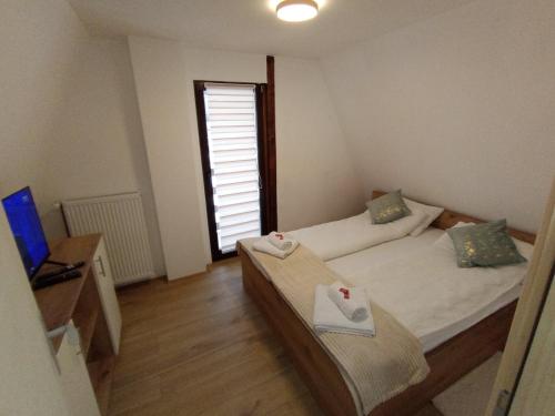 Een bed of bedden in een kamer bij Vila Bosa - Stara planina