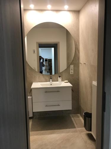 a bathroom with a sink and a mirror at Meckenheim in Meckenheim