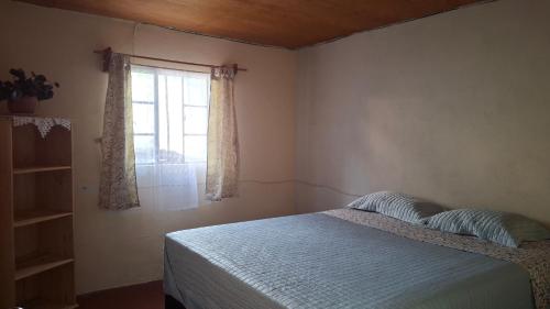 Postel nebo postele na pokoji v ubytování Casa Mary