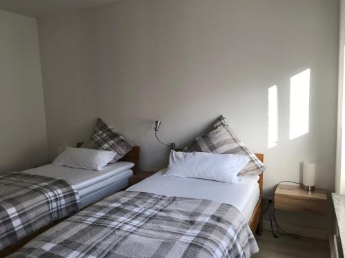 En eller flere senge i et værelse på Villa Cologne - Apartments & Monteursquartiere in Meckenheim bei Köln